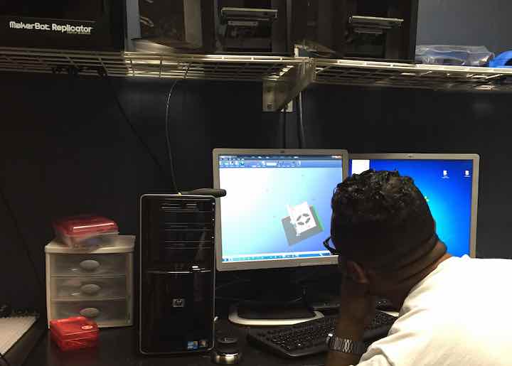 Industrial engineer Rashad Glover prepares the STL files for the 3D printer.
