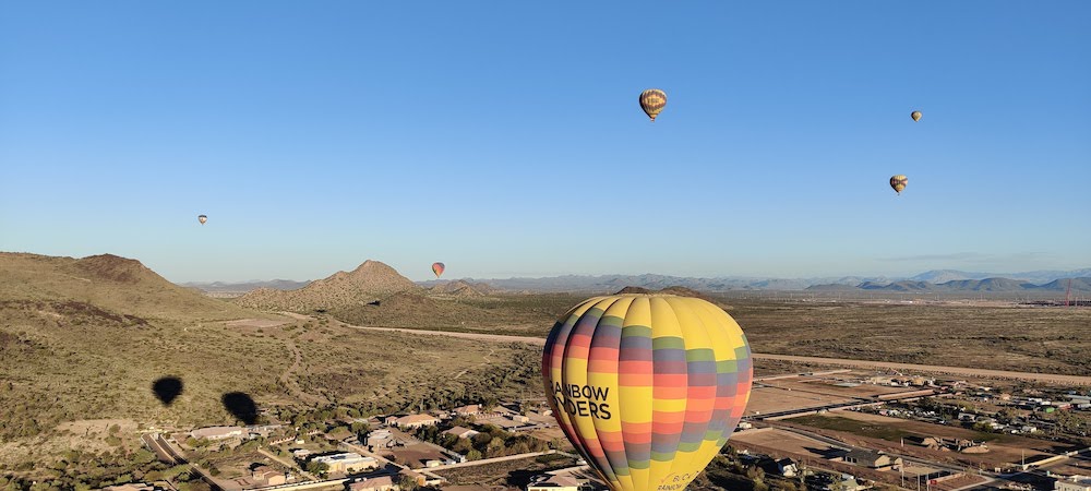 Phoenix skyline with hot air balloons.