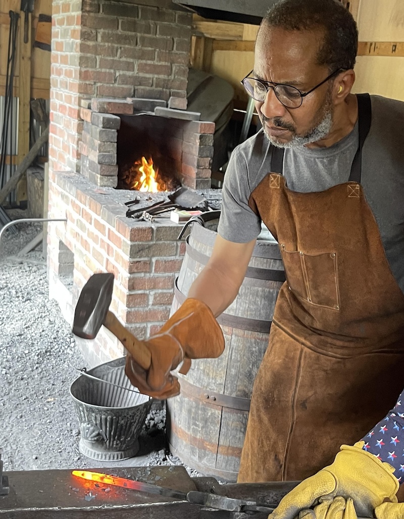 Strike While the Iron is Hot - Ray Hightower hanmering iron on an anvil